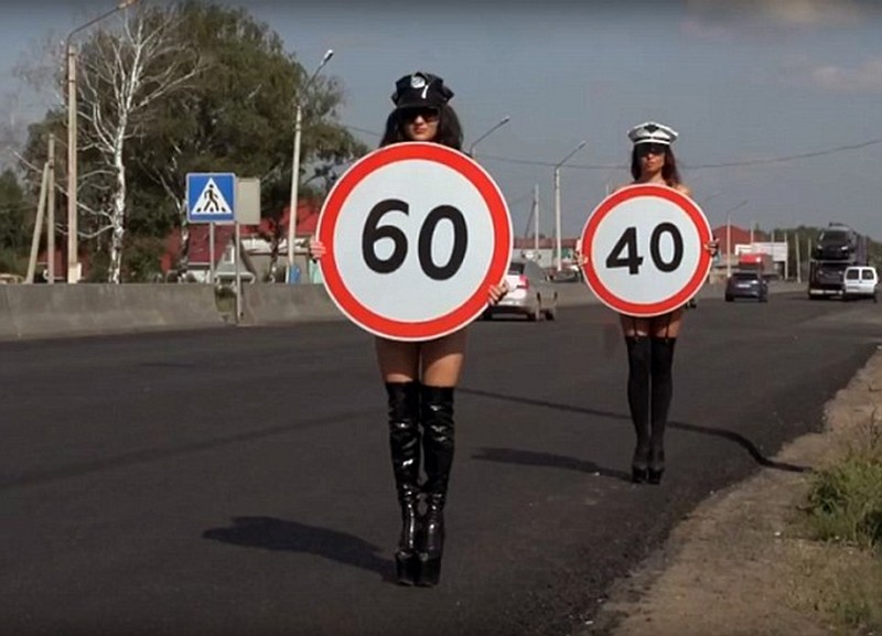 Topless Women Carry Speed Limit Signs For Road Safety Campaign in Russia 